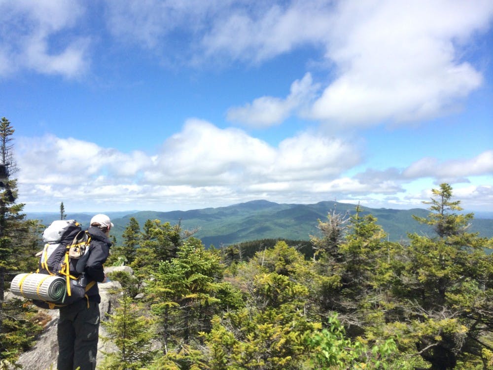 A hiker gazes north toward Mount Mansfield on the Long Trail, a path that traverses Vermont from North to South.