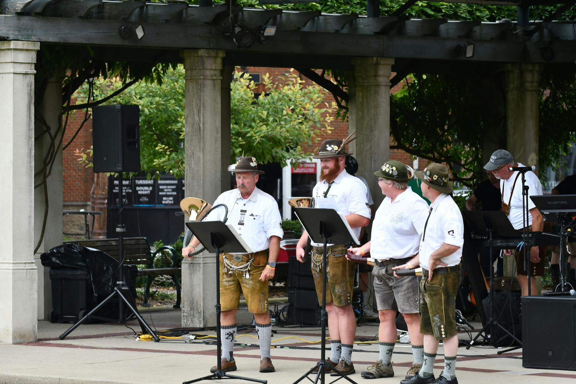 The Jagdhornbläsergruppe of Cincinnati, an independent hunting Horn group, performs at Uptown Park during Oxtoberfest on Sept. 13.