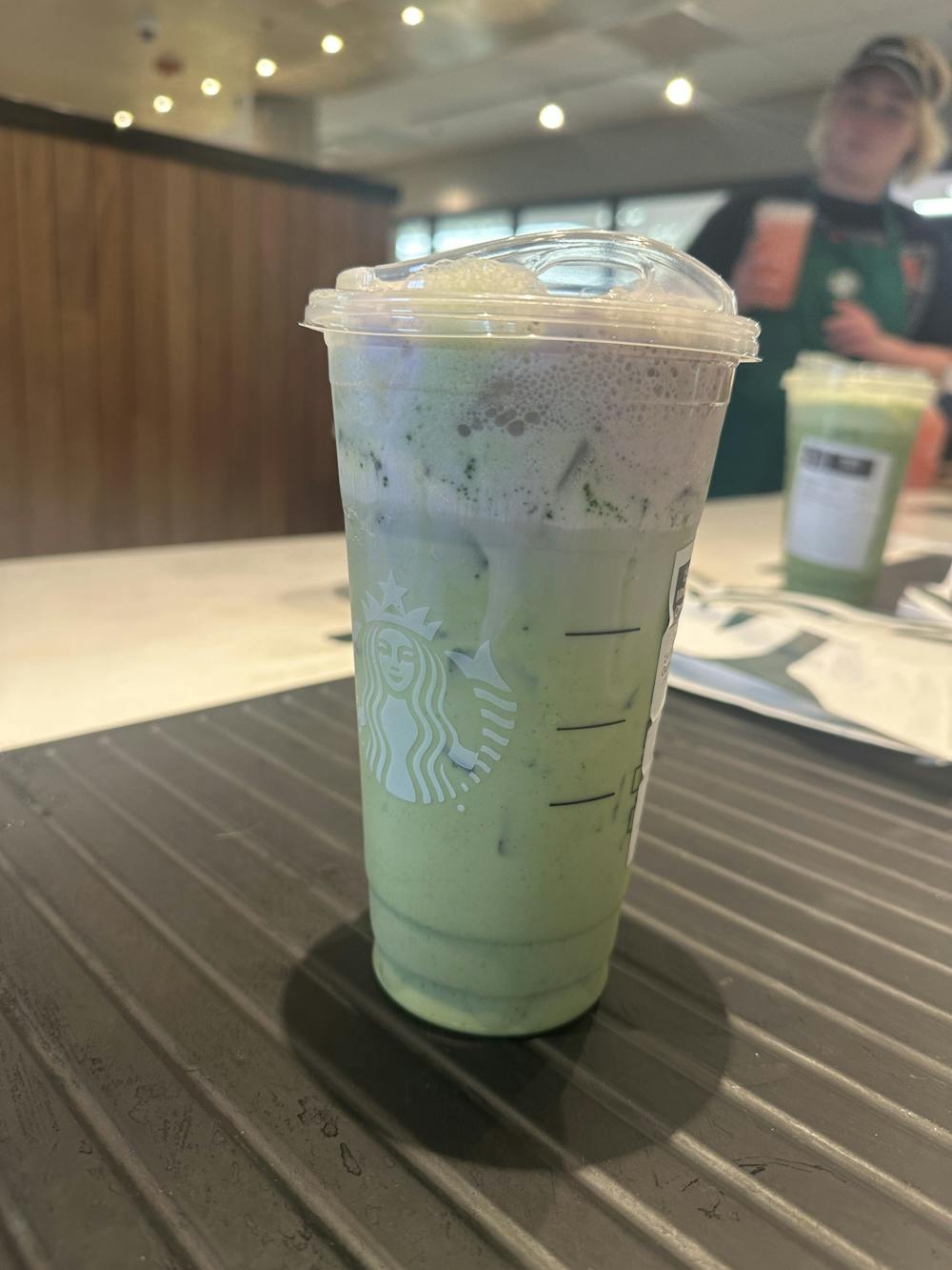 Featured is Starbucks' Iced Matcha Latte, which is topped with the new lavender cold foam, the only one of the new lavender drinks that is purple.