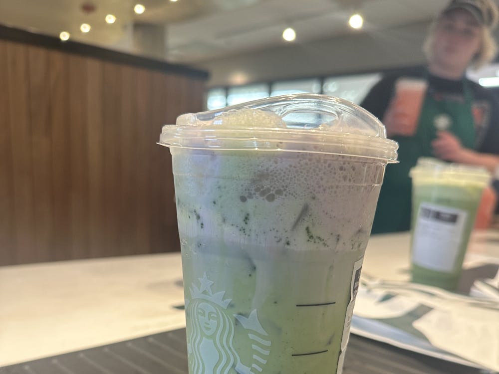 Featured is Starbucks' Iced Matcha Latte, which is topped with the new lavender cold foam, the only one of the new lavender drinks that is purple.