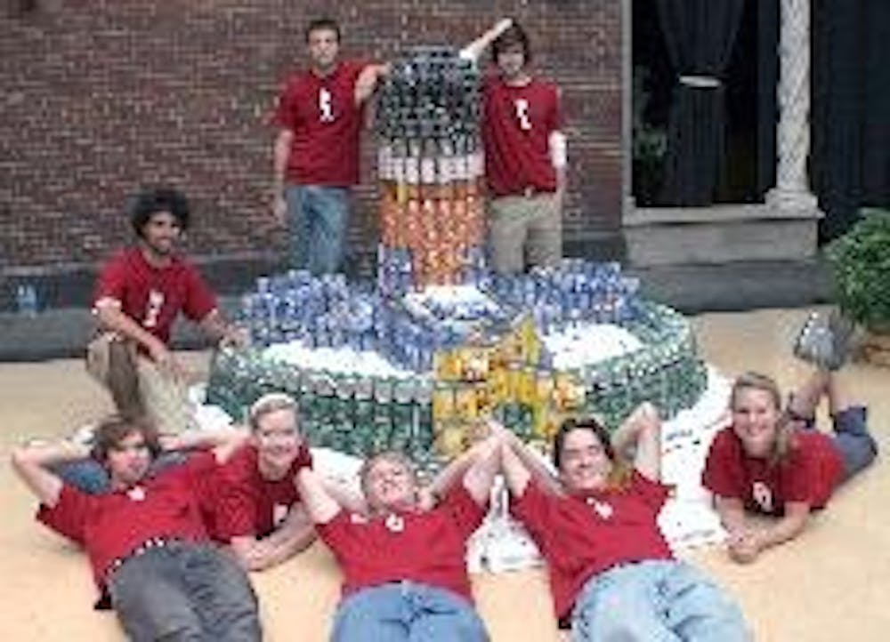 Members of the American Institute of Architecture Students show off their Canstruction.
