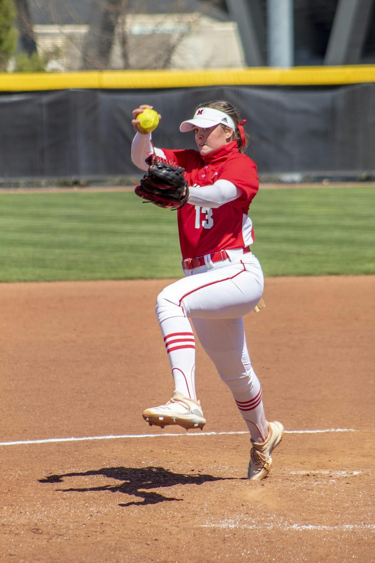 Senior star pitcher Courtney Vierstra throwing a strike at Miami Softball Stadium