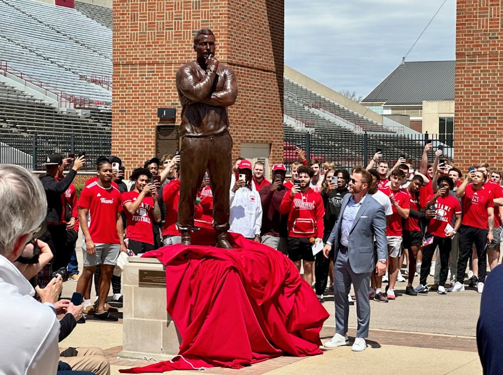 <p>Sean McVay (class of ‘08) looks upon his new statue as he reveals it to the public at his induction ceremony Saturday in the Cradle of Coaches Plaza on the south end of Miami University’s Yager Stadium.</p>