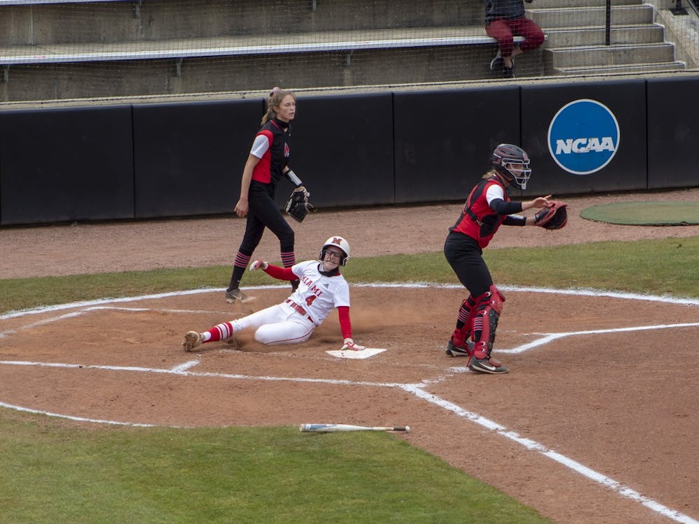 Senior infielder Mackenzie Moore slides into home plate during an April 20 doubleheader vs. Ball State.