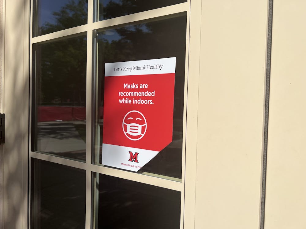 A sign outside Armstrong Student Center reads that "Masks are recommended while indoors." Miami University won't require masks this semester but advises students to be safe and responsible.