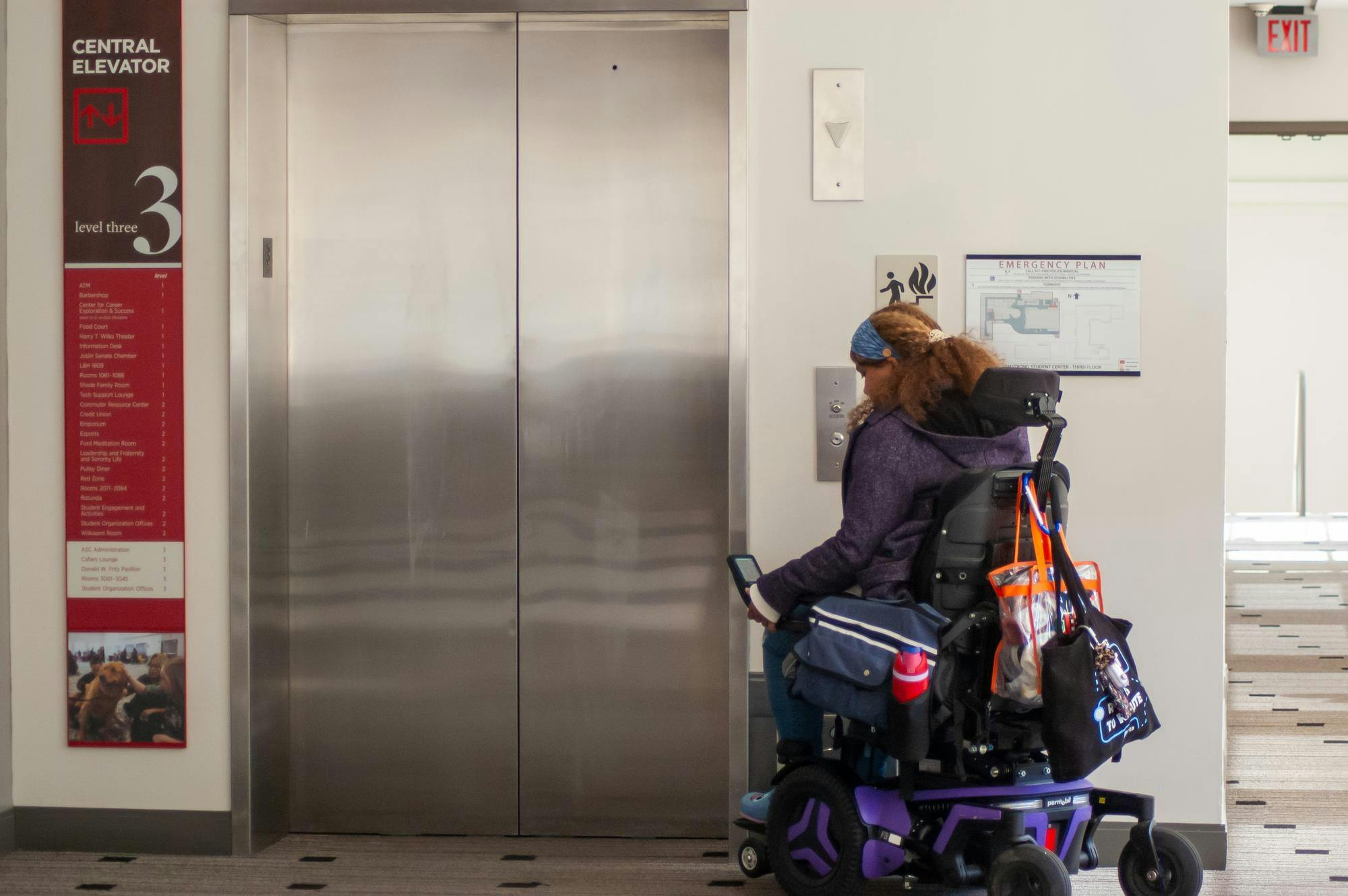 Whitney Wilson-Harris waits for the elevator. 