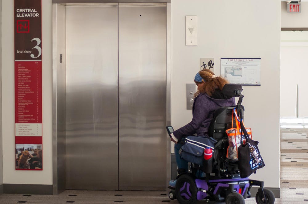 Whitney Wilson-Harris waits for the elevator.