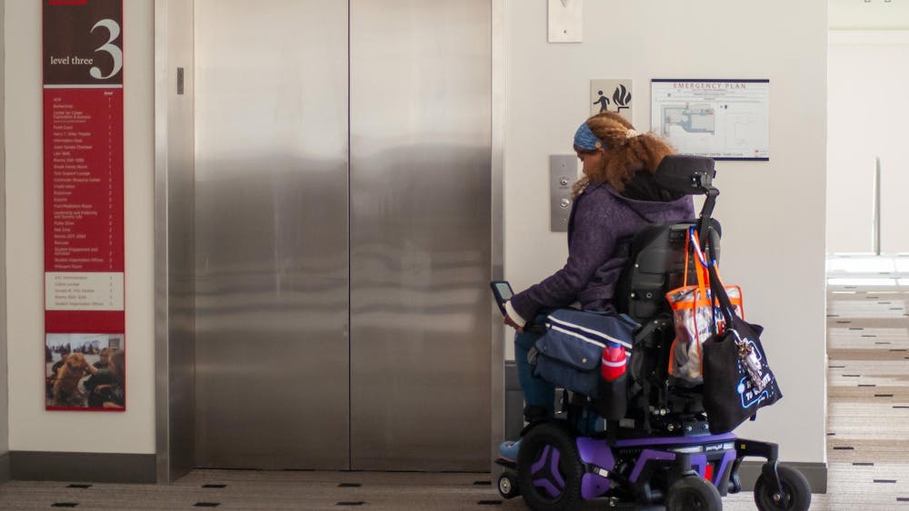 Whitney Wilson-Harris waits for the elevator.