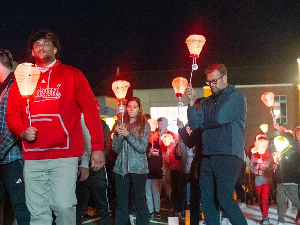 Attendees walking and carrying lanterns at last year's Light the Night