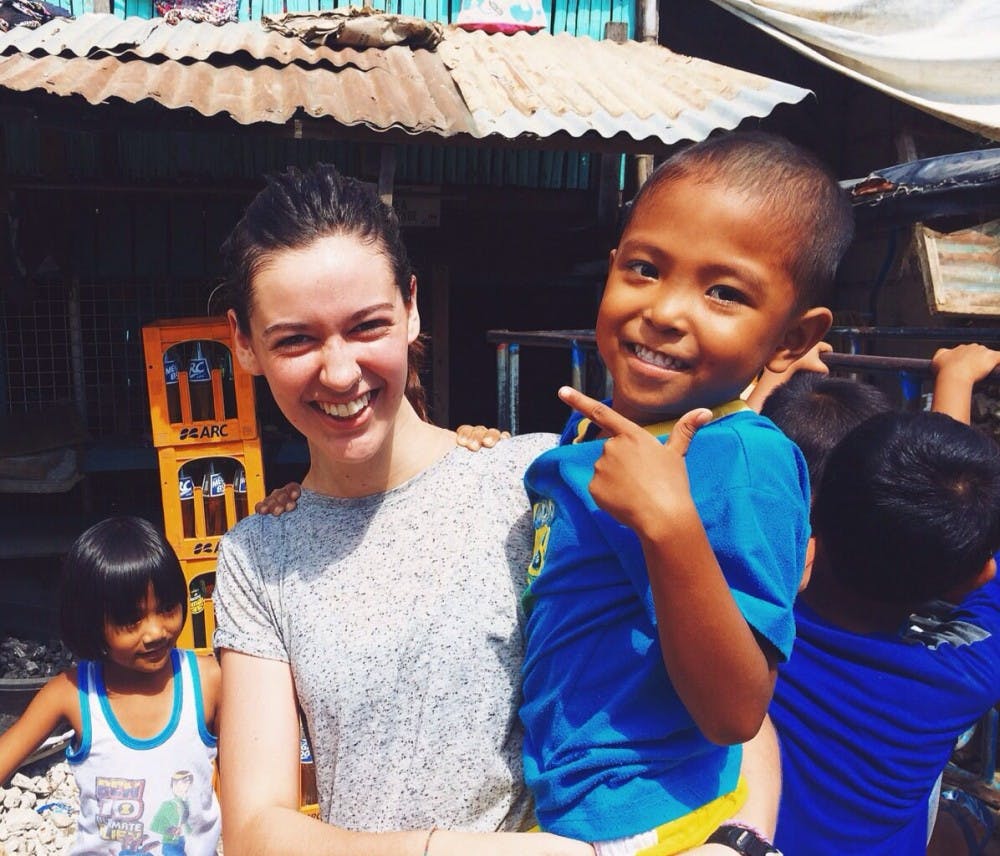 Dagool and I cheesing after a grueling game of monster. He is throwing a sign that means 'handsome' in Filipino culture. I only got to see him one other time after this day. | Photo by Kate Kelly