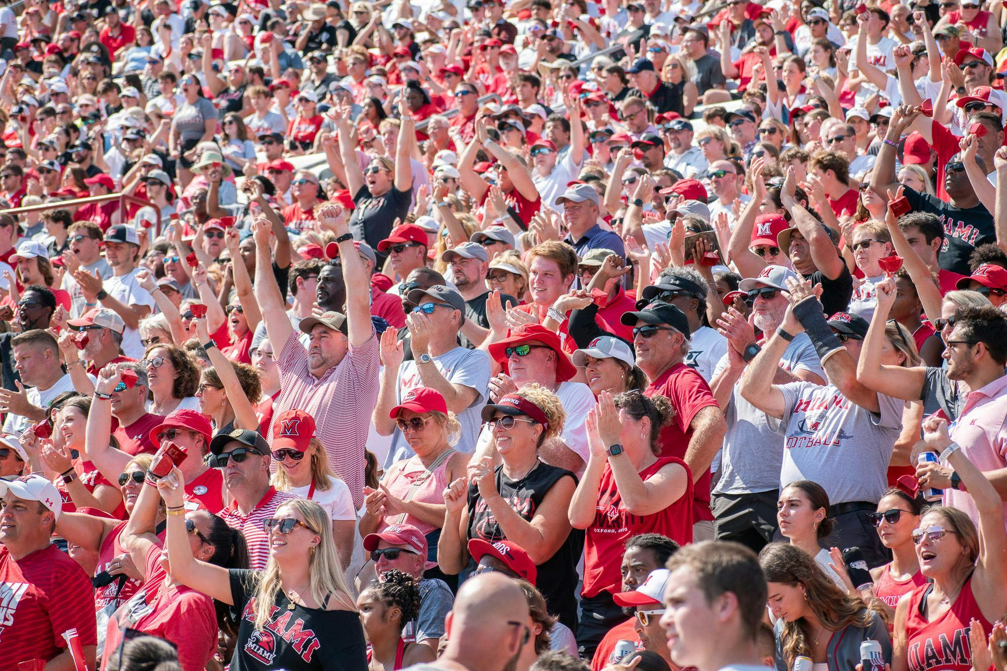 Miami fans celebrate during the 2024 Battle for the Victory Bell