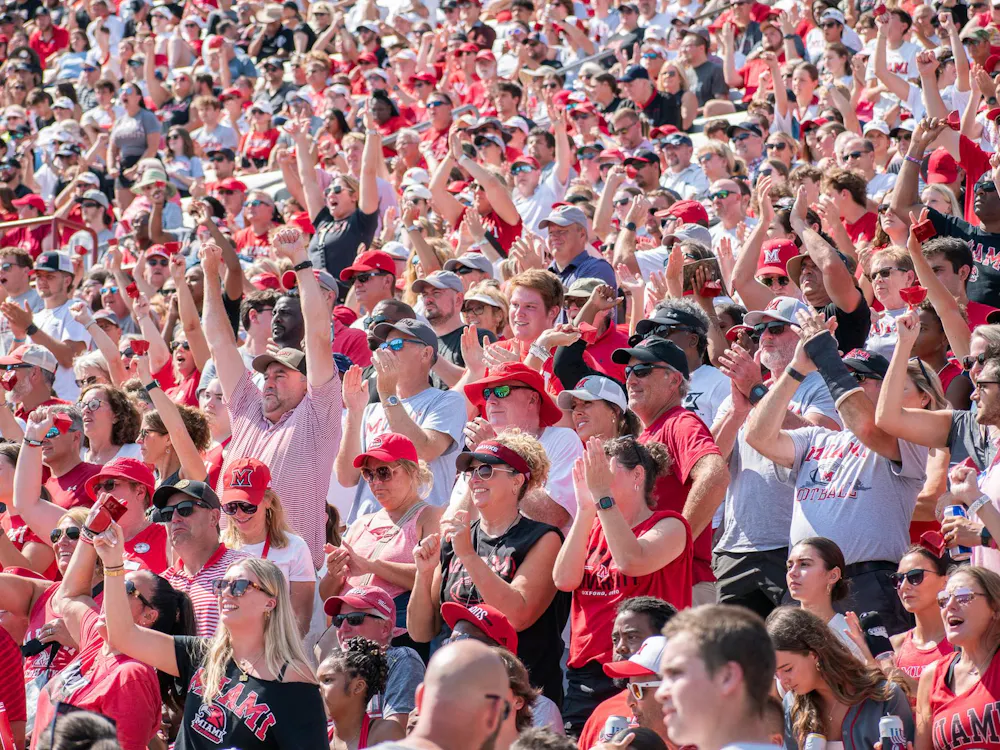 Miami fans celebrate during the 2024 Battle for the Victory Bell