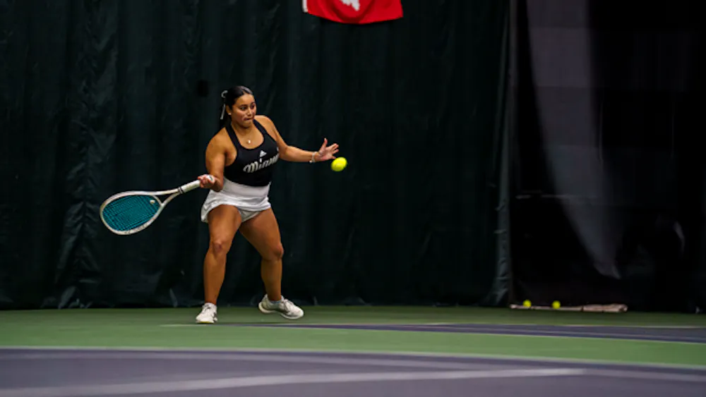 Freshman Nina Chavez hits a forehand in a match against Butler University.