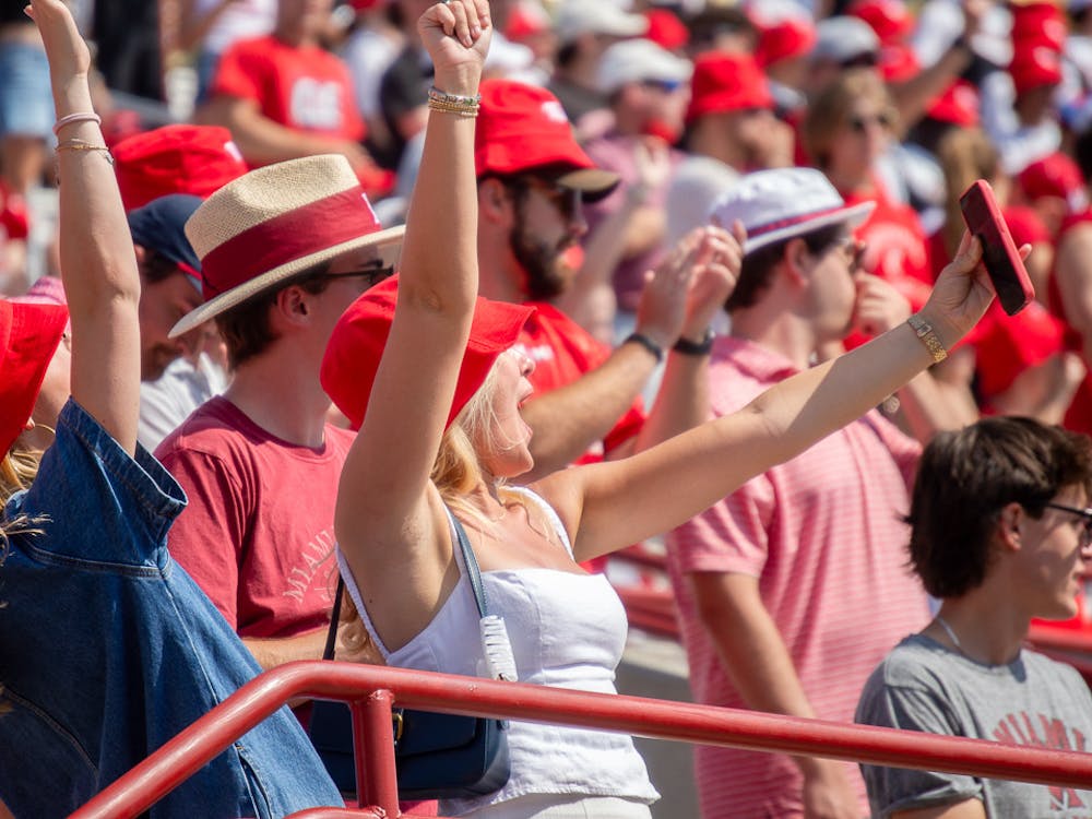 Miami fans cheer at a football game at Yager Stadium against the University of Cincinnati.