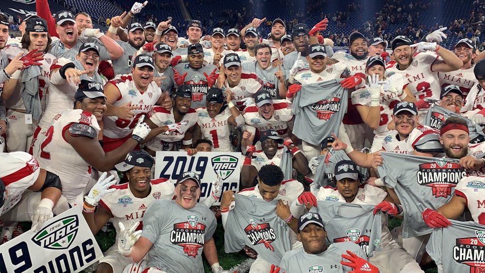 <p>The Miami RedHawks hold up their Mid-American Conference Champions shirts during the postgame celebration Saturday at Ford Field.</p>