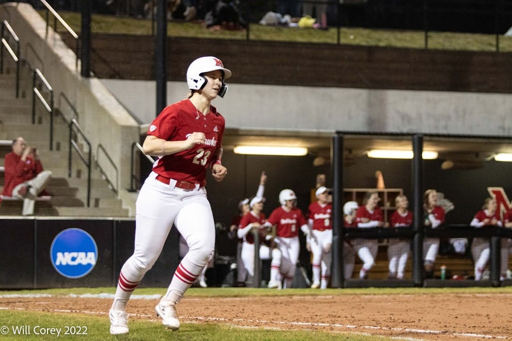 Graduate student outfielder Allie Cummins prepares to circle the bases after one of her three home runs on the night.