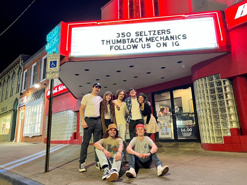 Local Oxford band Thumbtack Mechanics pose in front of Brick Street Bar on the night of a performance.