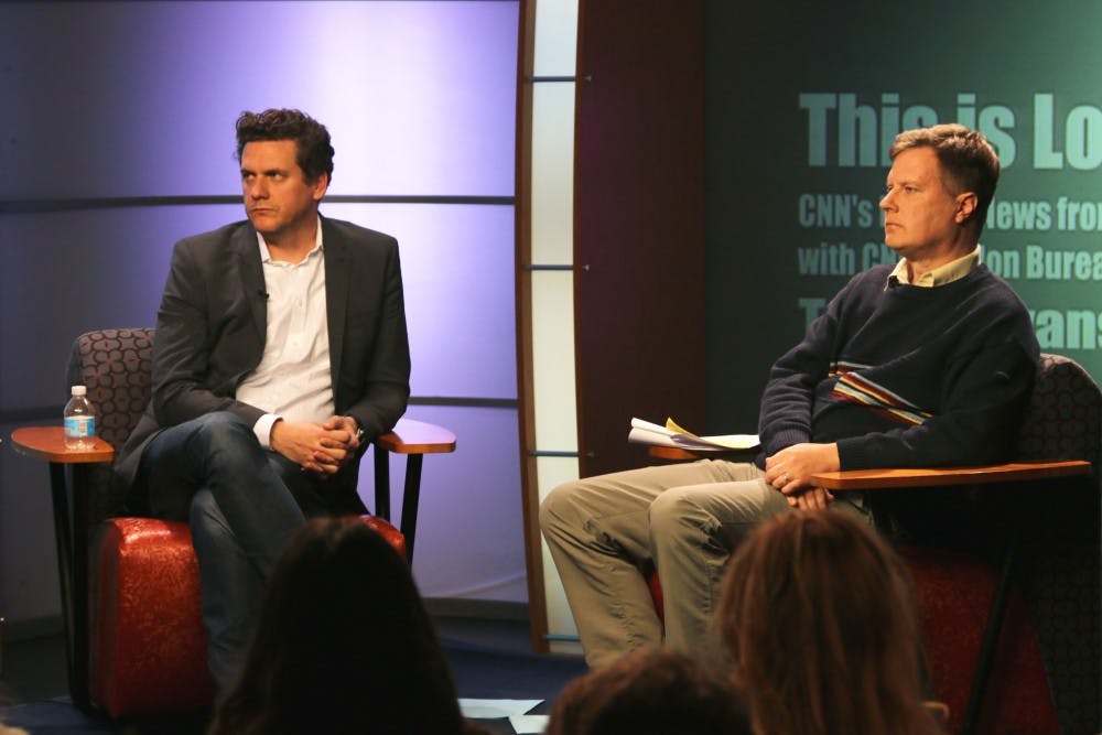 CNN London Bureau Chief Tommy Evans (left) sits with Journalism professor Joe Sampson. 
