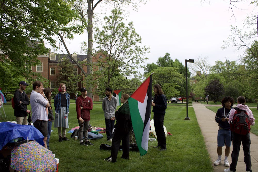Protesters were unable to keep a canopy tent up after administrators said it was against student organization policy.