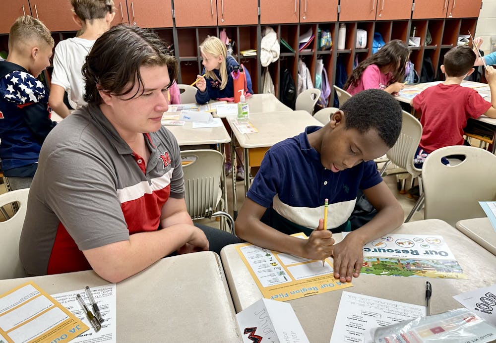 DSP member helps a Bogan third-grader brainstorm ideas for a business.