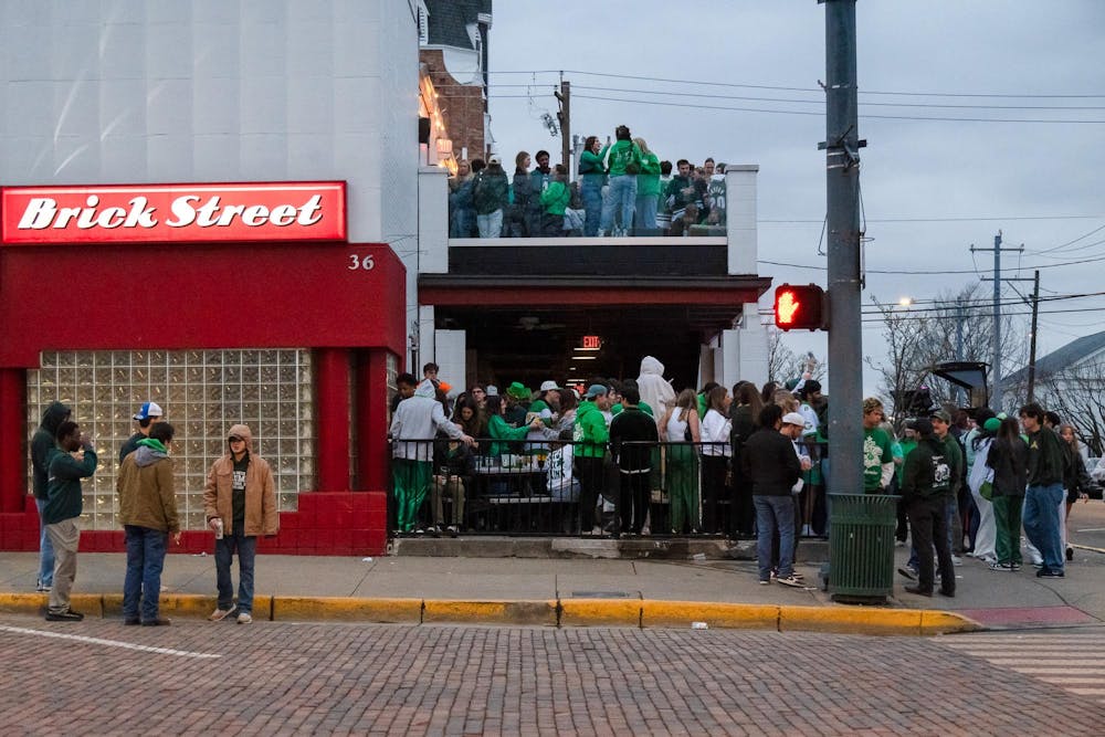 Dozens of students gather at Brick Street Bar to celebrate Green Beer Day 2025. 