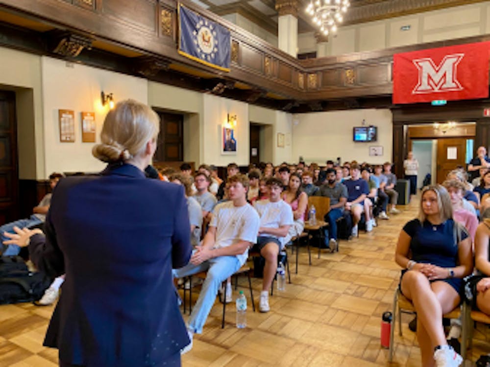 MUDEC students gather in the Grand Hall of the Chateau and listen to the Consul for the U.S Embassy Luxembourg, Kendra Arbaiza-Sundal share information about voting overseas