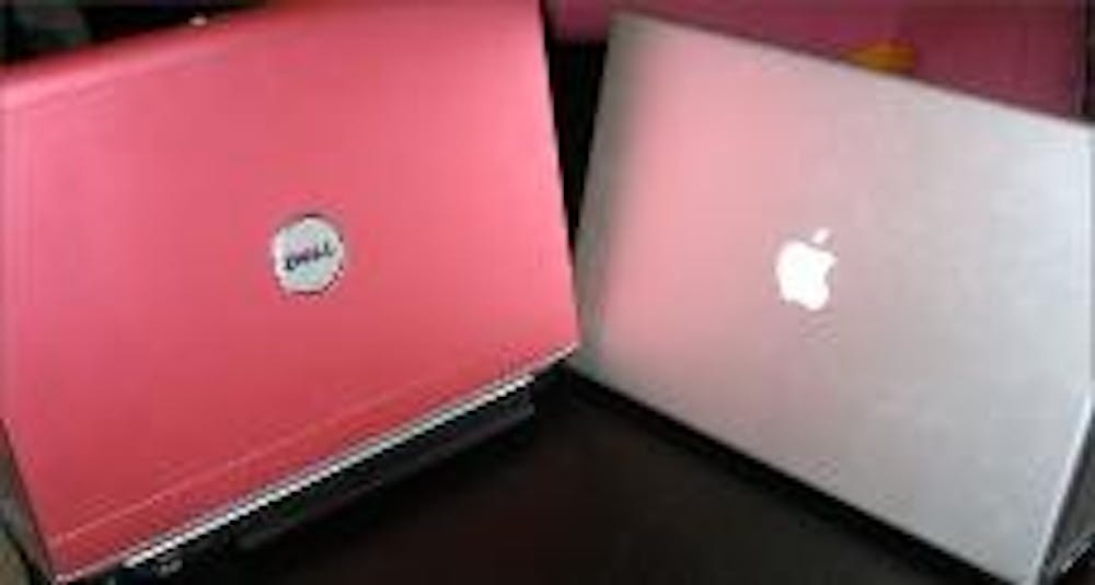 Sixty-three percent of first-year students that participated in the Miami Notebook program this year chose Macs, like the MacBook Pro, seen right, instead of the PC option, like the Inspiron 1420 from Dell, seen left. The program currently offers students a choice between Macintosh and Hewlett-Packard computers.