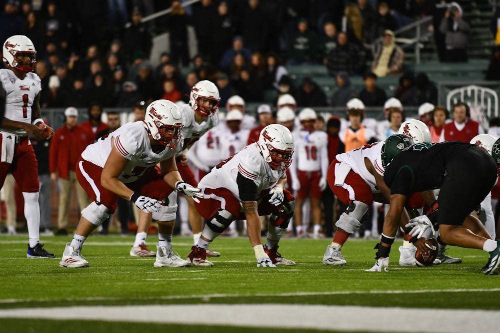 The Miami football offensive line prepares for a snap against Ohio University at Peden Stadium on Nov. 4