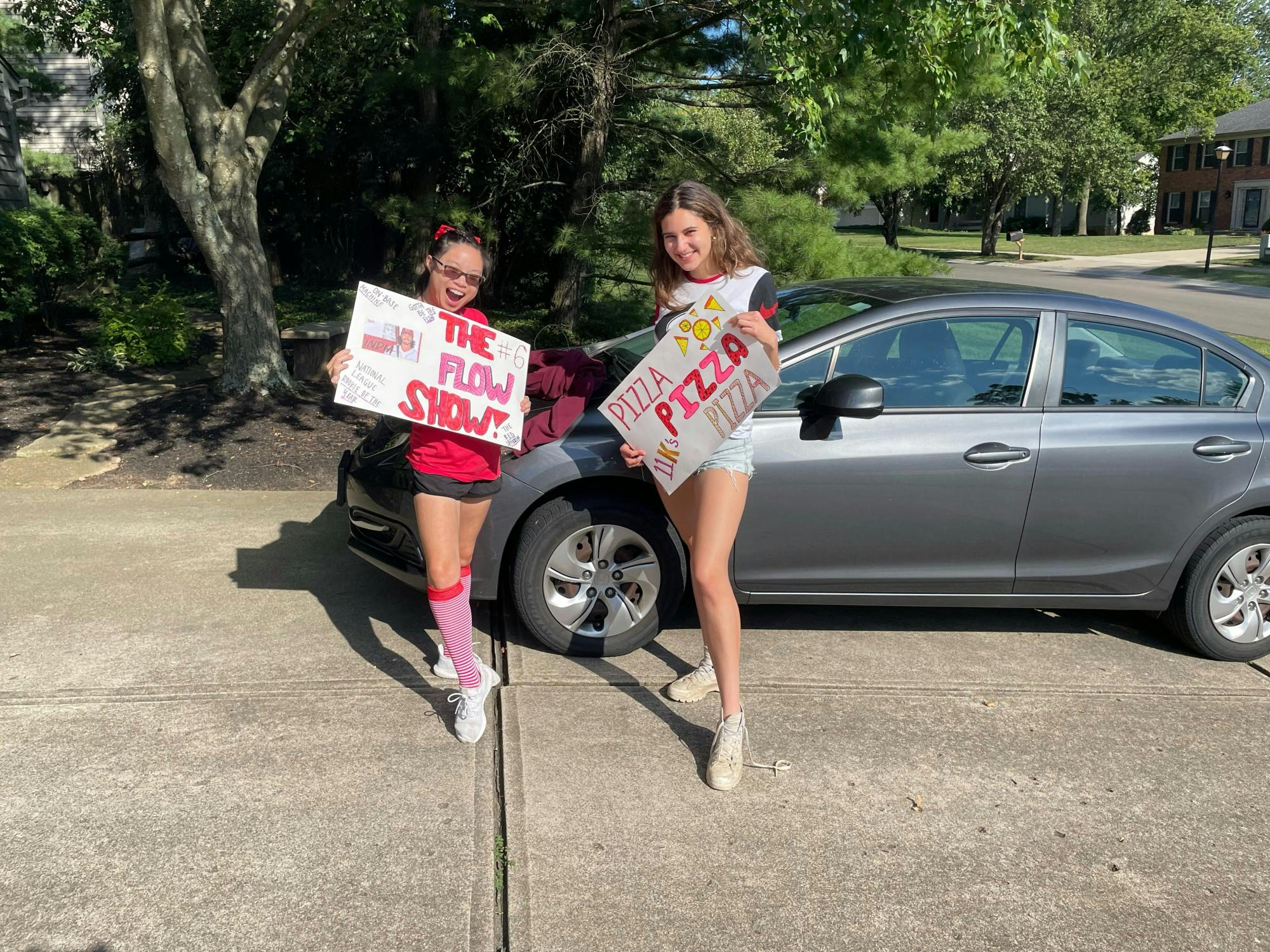 Lily with her friend before going to a Cincinnati Reds game.