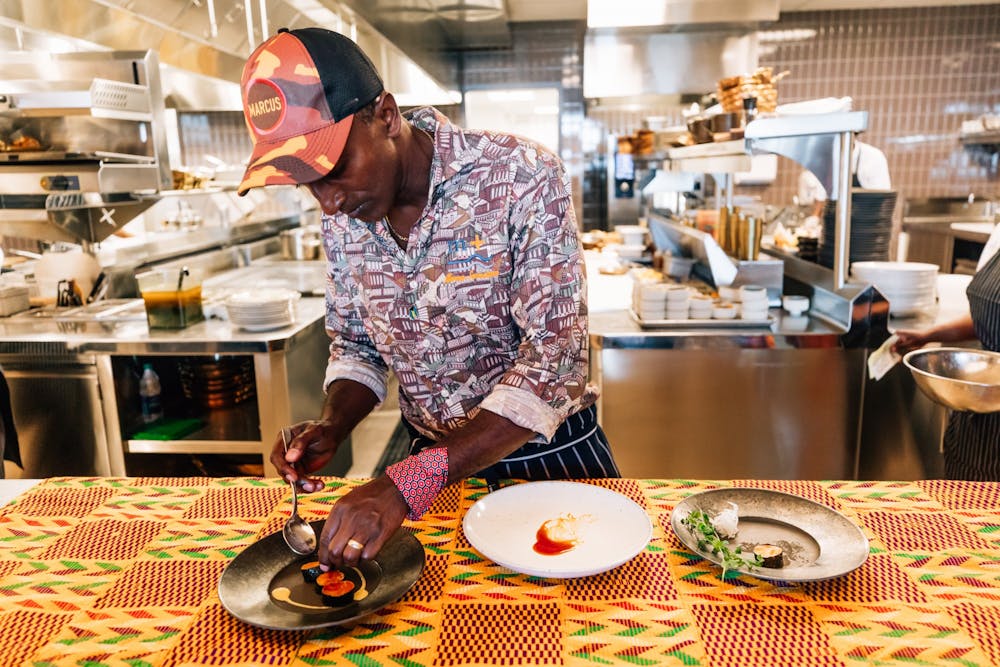 Food Network chef, Marcus Samuelsson prepares one of his meals 