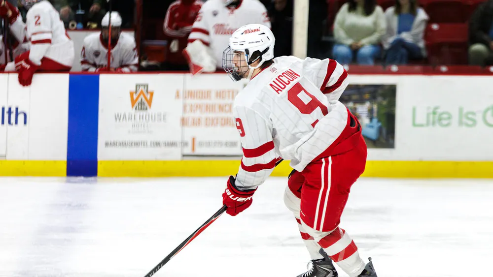 Kyle Aucoin maintains control of the puck in game against the Colorado College Tigers on Dec. 12, 2025.