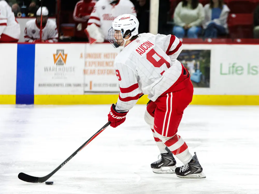 Kyle Aucoin maintains control of the puck in game against the Colorado College Tigers on Dec. 12, 2025.