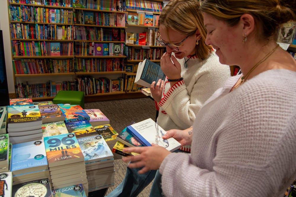 Atlanta natives Avery Halseth and Kali Holierhoek browse a table of books at a Barnes & Noble in Marietta, GA.