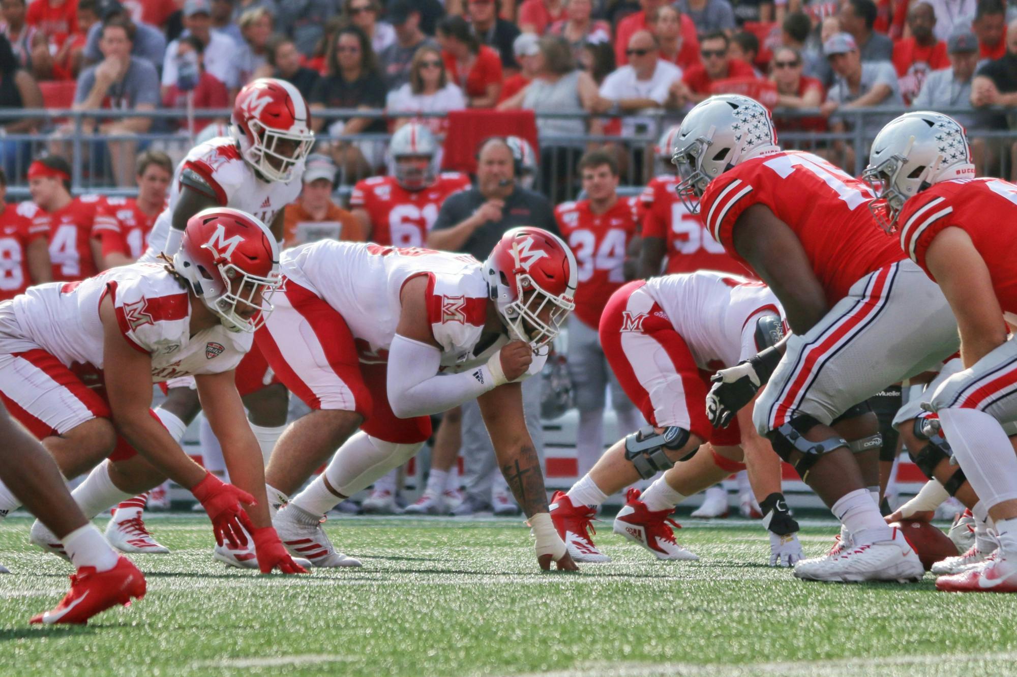 Senior defensive lineman Doug Costin (middle) lines up against Ohio State during a 76-5 Miami loss Sept. 21 at Ohio Stadium.