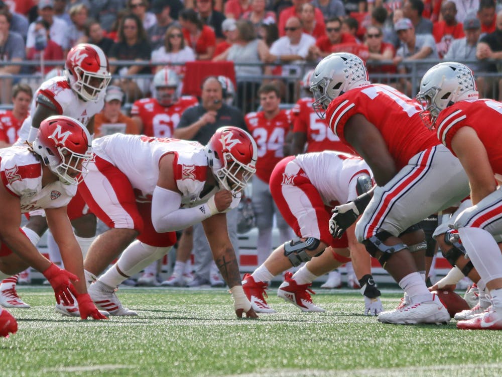 Senior defensive lineman Doug Costin (middle) lines up against Ohio State during a 76-5 Miami loss Sept. 21 at Ohio Stadium.