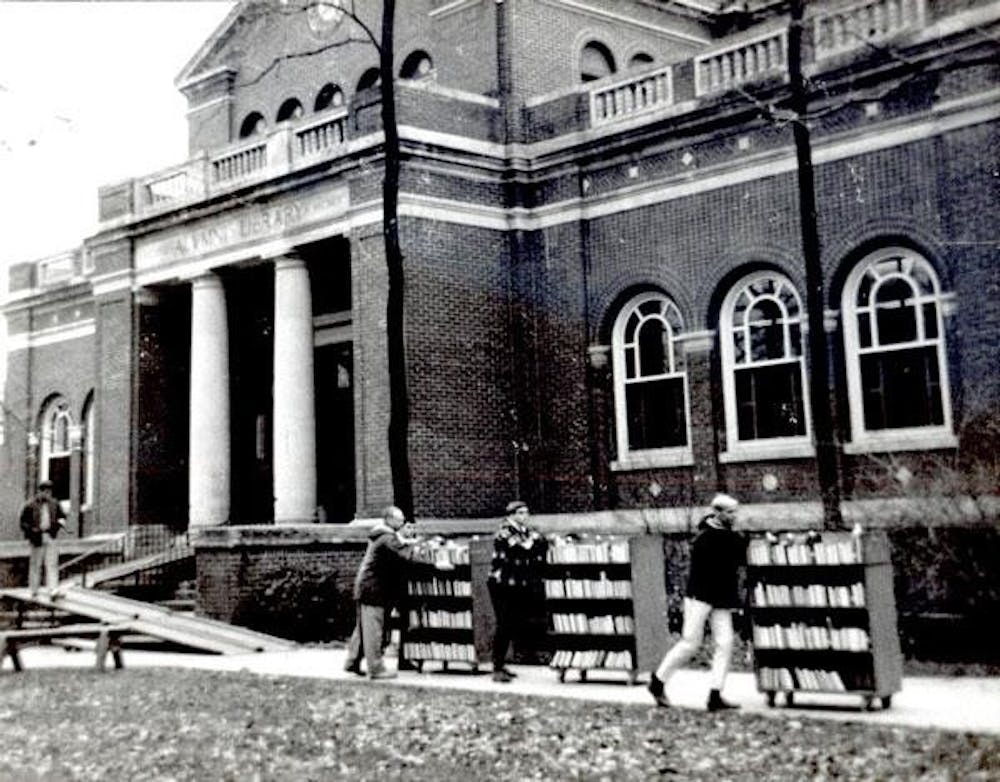 Volunteers from 22 social fraternities moved 40,000 books from Alumni Hall to the new King Library Nov. 19, 1966.