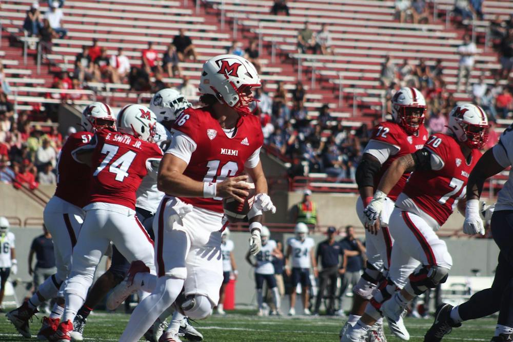 Redshirt-freshman quarterback David McComb rolls out right in game against the University of Connecticut on Sept. 26, 2026. 