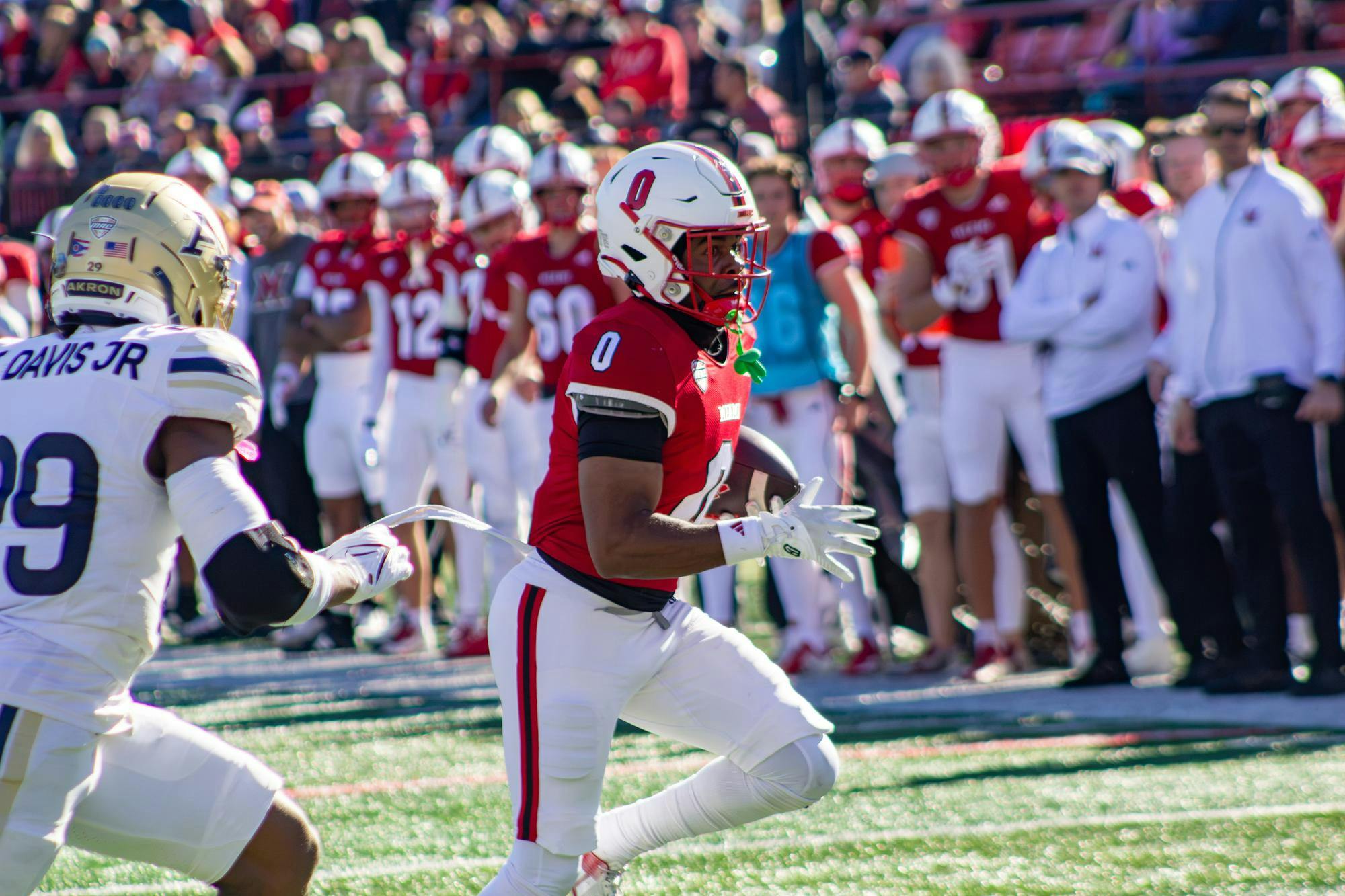 Rodney Nelson runs the ball to the end zone in game against Akron