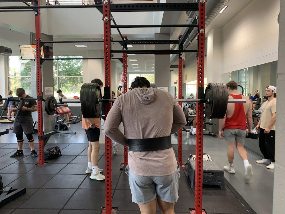 Senior Kevin Kaufman ﻿prepares to squat nearly 500 pounds at the Miami University Recreation Center.