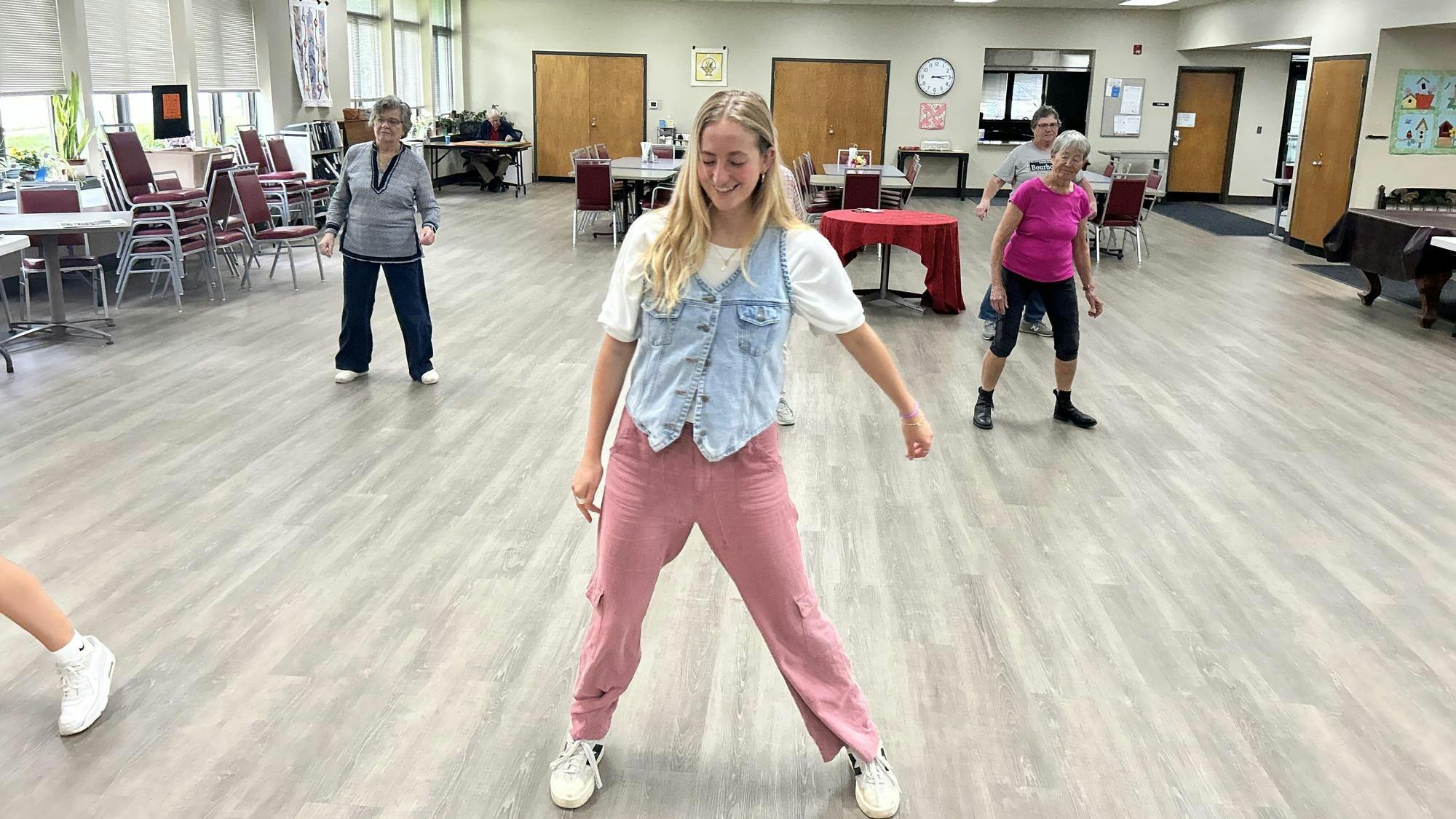  Kylie Gunning leads line dancing lessons during Wednesday’s session at Oxford Seniors. She was employed through Miami University’s Service+ program, which was abruptly discontinued in late April due to federal funding cuts to the AmeriCorps program. 