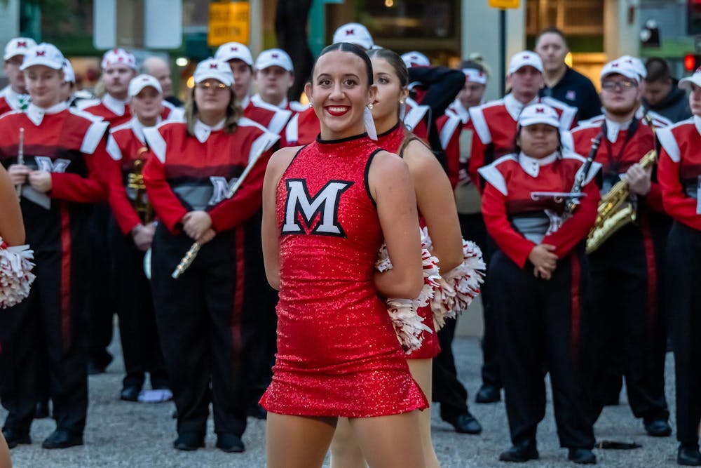 <p>Ally Winter, senior communication captain on the Miami University Shakerettes, waits for her team's performance during the Snoop Dogg Arizona Bowl Pep Rally on Dec. 26.</p>