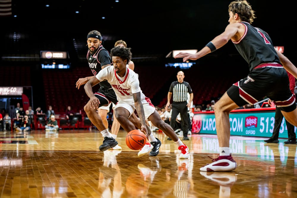 Sophomore guard Mekhi Cooper driving for the hoop at Millett Hall against the Trojans on Feb. 8