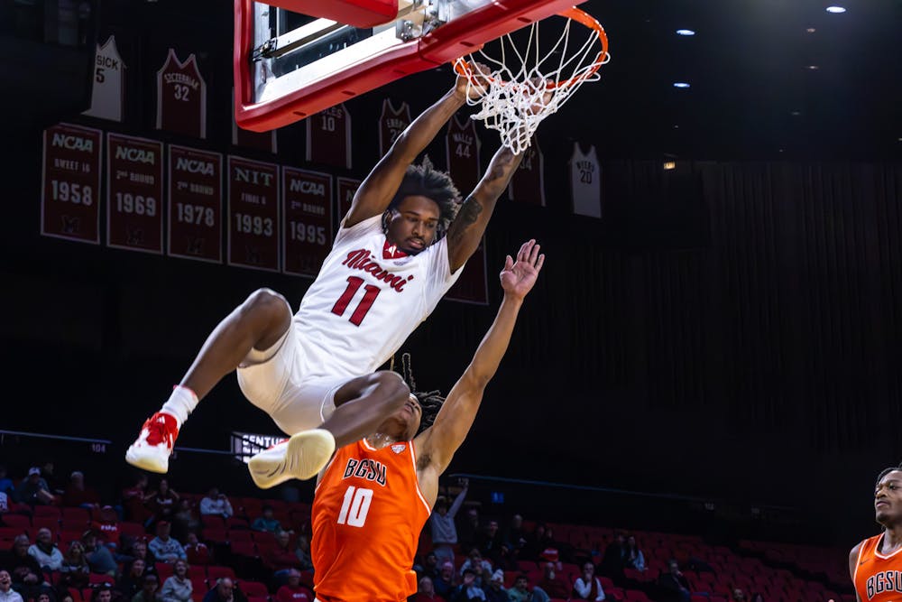 Sophomore guard Mekhi Cooper dunking on Bowling Green senior guard Derrick Butler at Millett Hall on Jan. 21