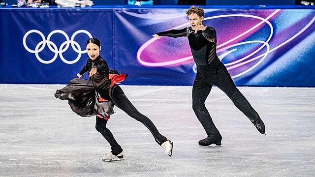 Madison Chock (left) and Evan Bates (right) skate at the Winter Olympics in Milano Cortina