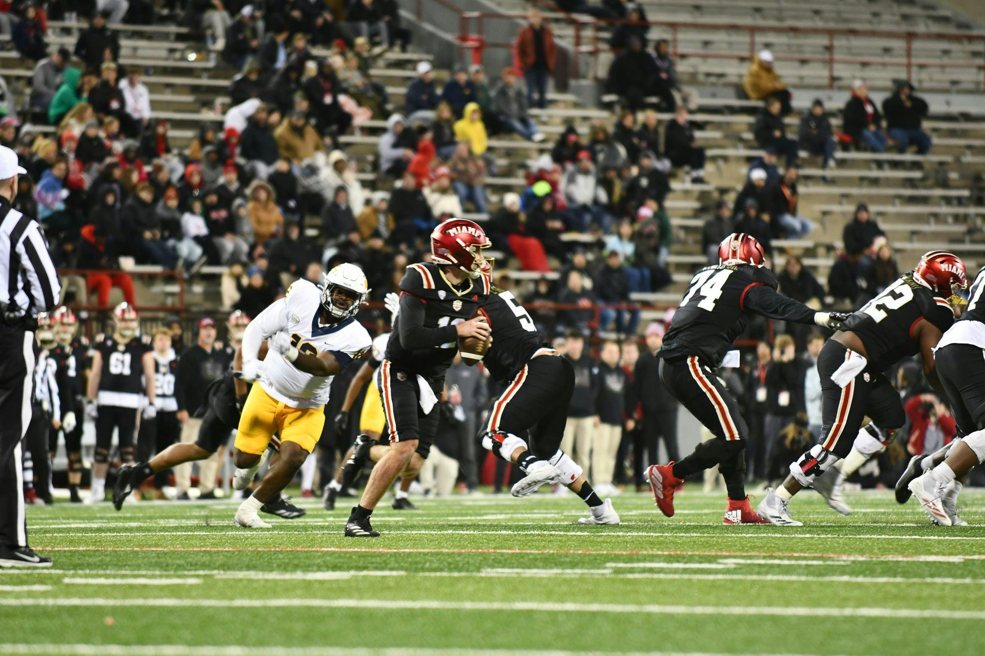 Redshirt senior quarterback Henry Hesson steps back in the pocket looking to pass against Toledo at Yager Stadium on Nov. 12