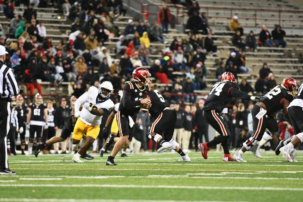 Redshirt senior quarterback Henry Hesson steps back in the pocket looking to pass against Toledo at Yager Stadium on Nov. 12