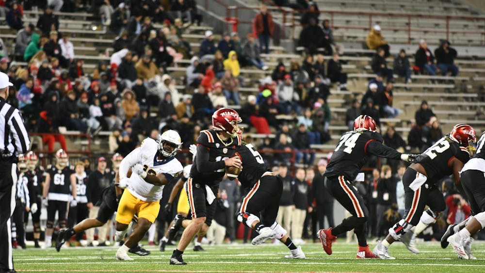 Redshirt senior quarterback Henry Hesson steps back in the pocket looking to pass against Toledo at Yager Stadium on Nov. 12