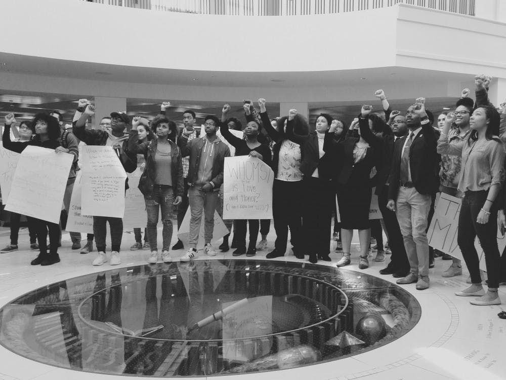 Student activists stand in solidarity by the Seal after BAM 2.0 leadership met with administrators.