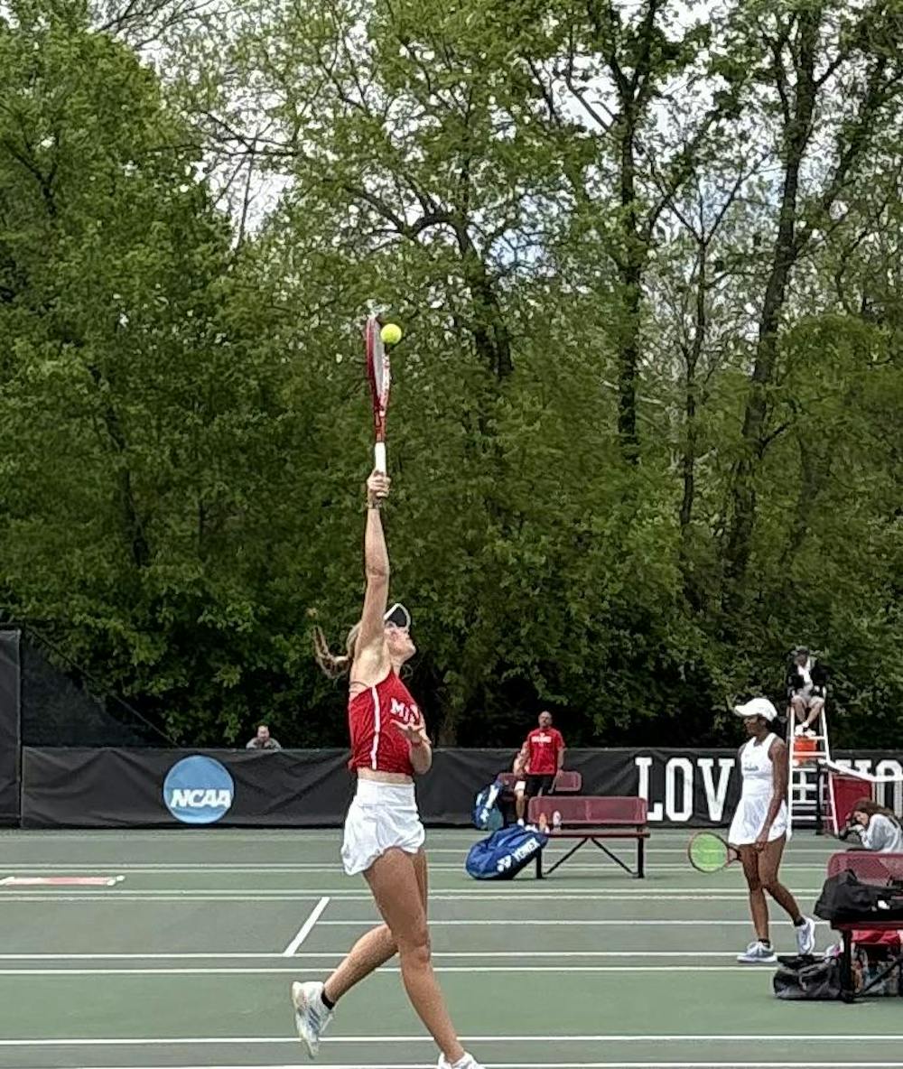 Freshman Evelyn Risner hits an overhead shot in singles match against Toledo.