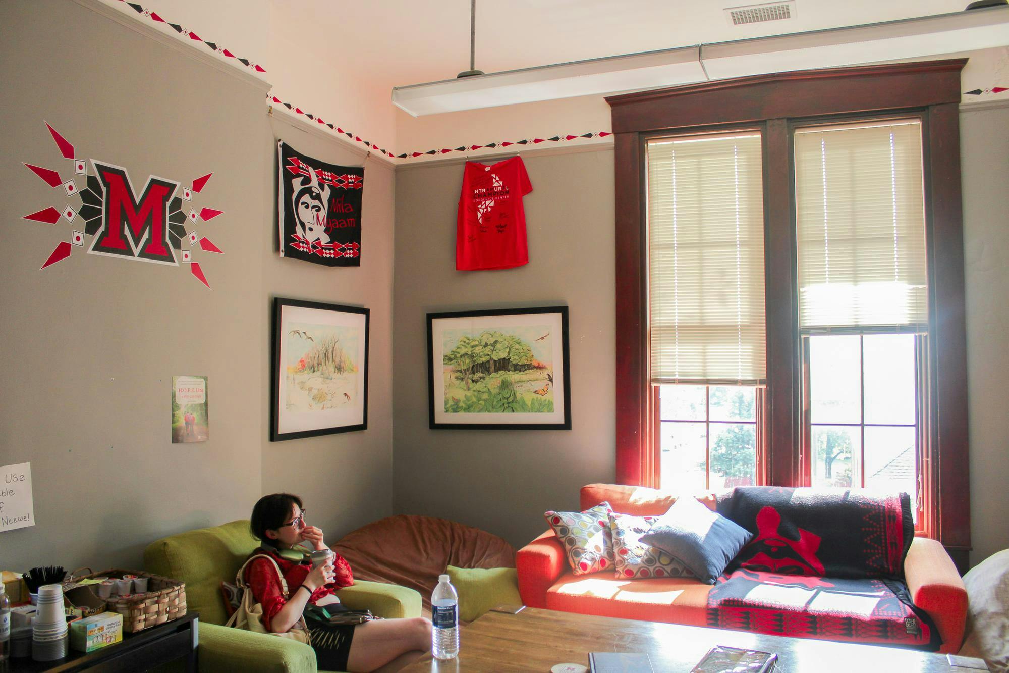 Student sits in lounge room in the Myaami Center on campus. Photo by.